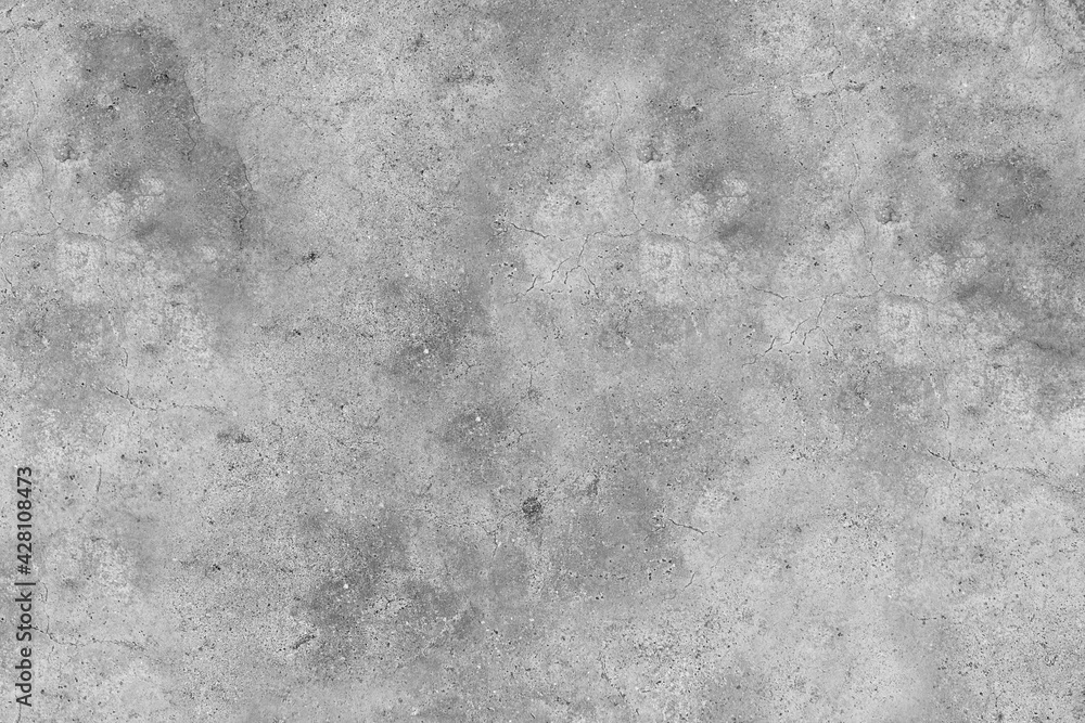 Obraz premium Textured grey concrete wall with cracks on the surface
