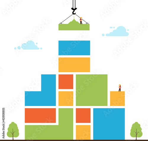 Tower crane made of colored blocks builds home.