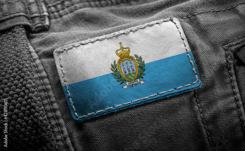 Tag on dark clothing in the form of the flag of the San Marino photo