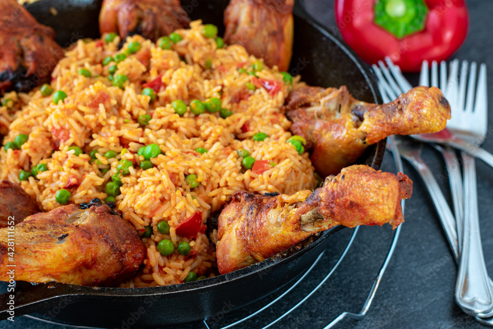 fresh oven baked chicken drumsticks with mediterranean rice served in a pan