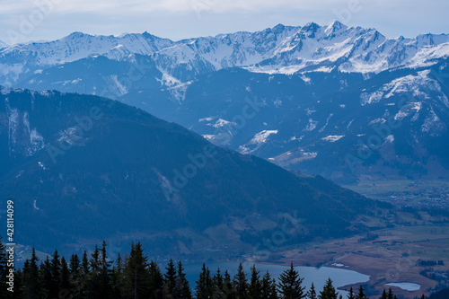 beautiful view to the lake from zell am see, austria, on a cloudy day and view to the alps in spring