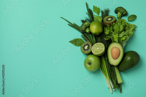 Bild auf Leinwand Fresh green vegetables on mint background, space for text
