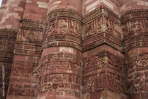 Arabic inscription on the tower. Detail. The Qutb Minar is a victory tower, watchtower and minaret in the Qutb complex in Delhi. Daylight. © Patrick Ranz