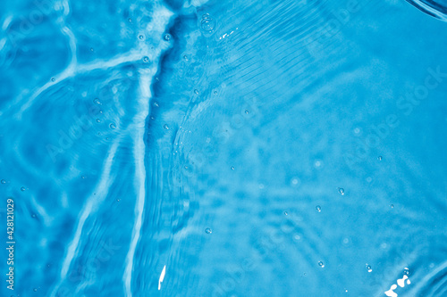 Blue water ripples and splashes. Blue waves texture. 