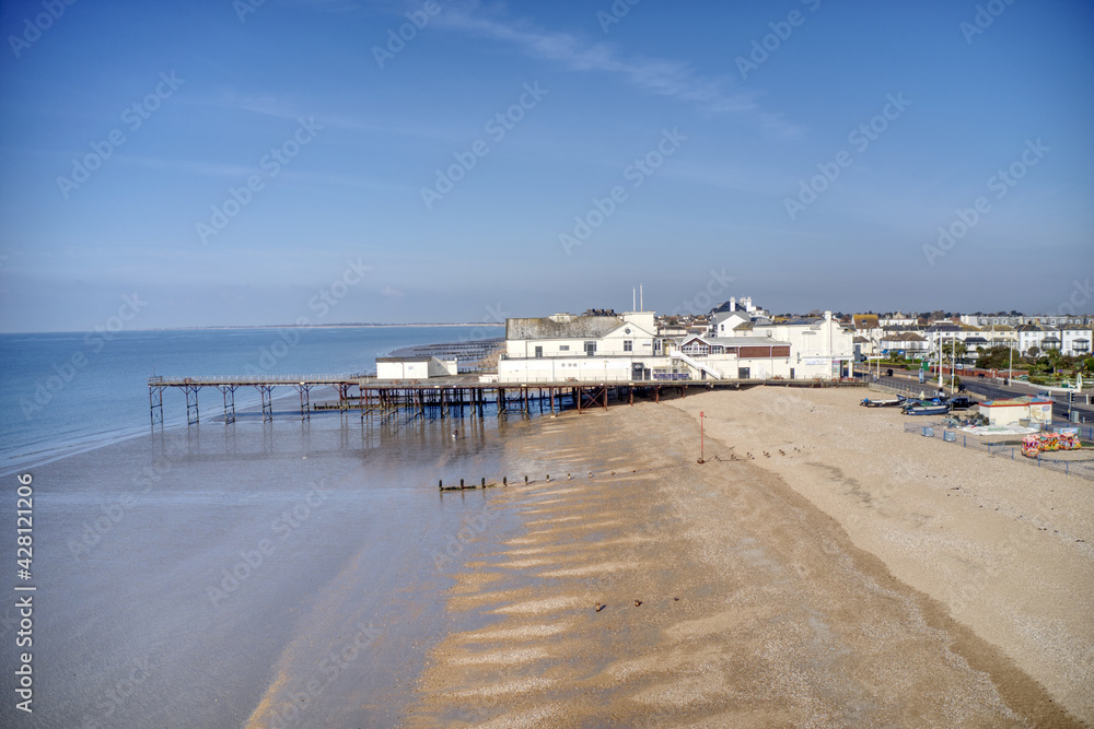 Aerial View towards Bognor Regis Pier a Victorian Building situated on a wide beach on a clear and sunny spring day at this popular tourist destination. Aerial View towards Bognor Regis Pier a Victorian Building situated on a wide beach on a clear and sunny spring day at this popular tourist destination.