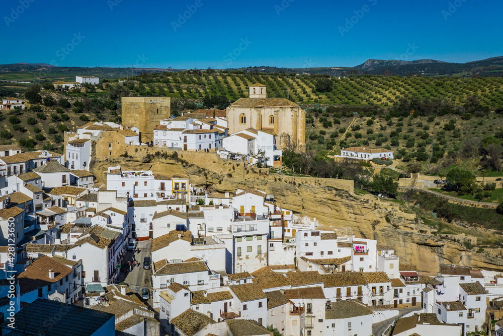 View on Setenil de las Bodegas and the church of one of the most famous white villages (pueblo blanco) of Andalusia (Spain)