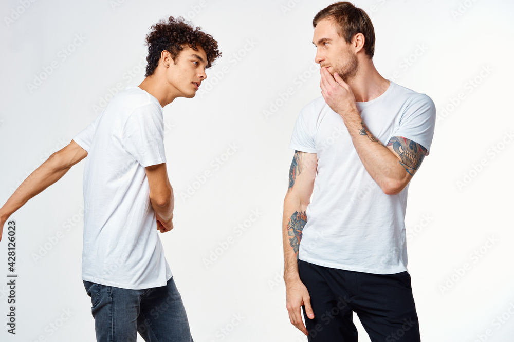Cheerful friends in white t-shirts emotions movement Cheerful friends in white t-shirts emotions movement