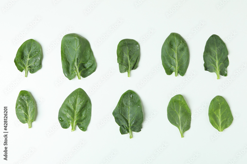 Fresh raw spinach leaves on white background Fresh raw spinach leaves on white background