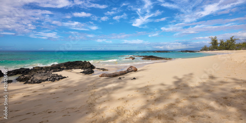 Panoramic view of the sand beach and blue ocean in Hawaii.