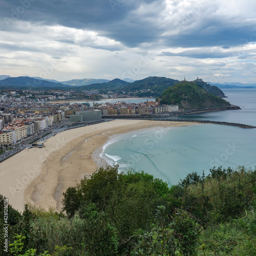 Wallpaper Mural San Sebastian, Spain - Feb 19, 2021: Sunset over Monte Urgull from Zurriola beach Torontodigital.ca