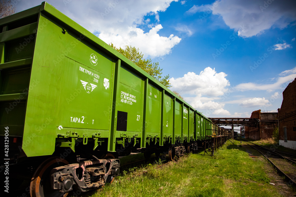 Obraz premium New green railroad hopper car. Train car-building plant. Petropavl, Kazakhstan.