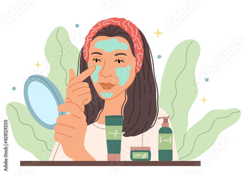 The girl puts a mask in front of a mirror.Organic skin care, lifestyle. Beauty spa and cosmetology.Put moisturizing lifting nourishing day creme on soft hydrated moisturized skin in bathroom.