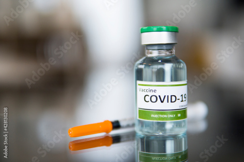 bottle of medicine with a syringe, corona vaccine