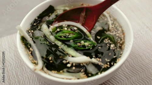 Sweet and sour soup with cucumber and seaweed