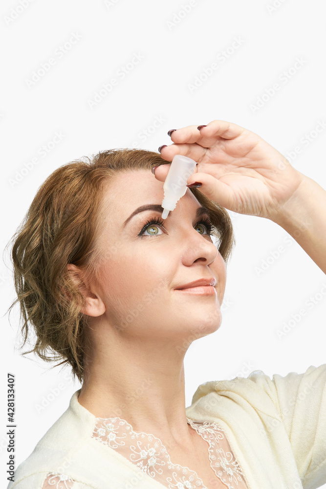 Fototapeta premium Woman using eye drops. Medicine treatment. Eyecare human problem. Ophtalmology dropper.