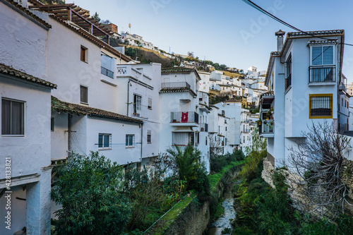 View on the white houses of the small village of Setenil de las Bodegas, one of the most famous white villages (Pueblo Blanco) of Andalusia, Spain © Pernelle Voyage