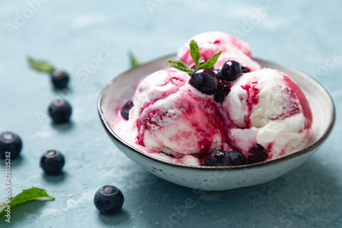 Homemade yogurt and blueberry ice cream with natural blueberry syrup photo