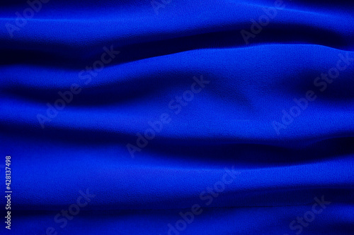 Blue fabric cotton background. display abstract texture luxury cloth soft wave. for well use text present or promote your goods, products on free space background. top view or flat lay.