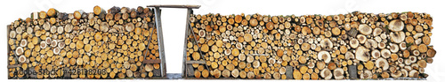 Rustic fence made from logs of firewood  isolated