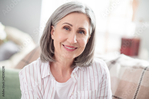 Photo of happy positive old lady smile good mood face weekend free time indoors inside house home flat apartment