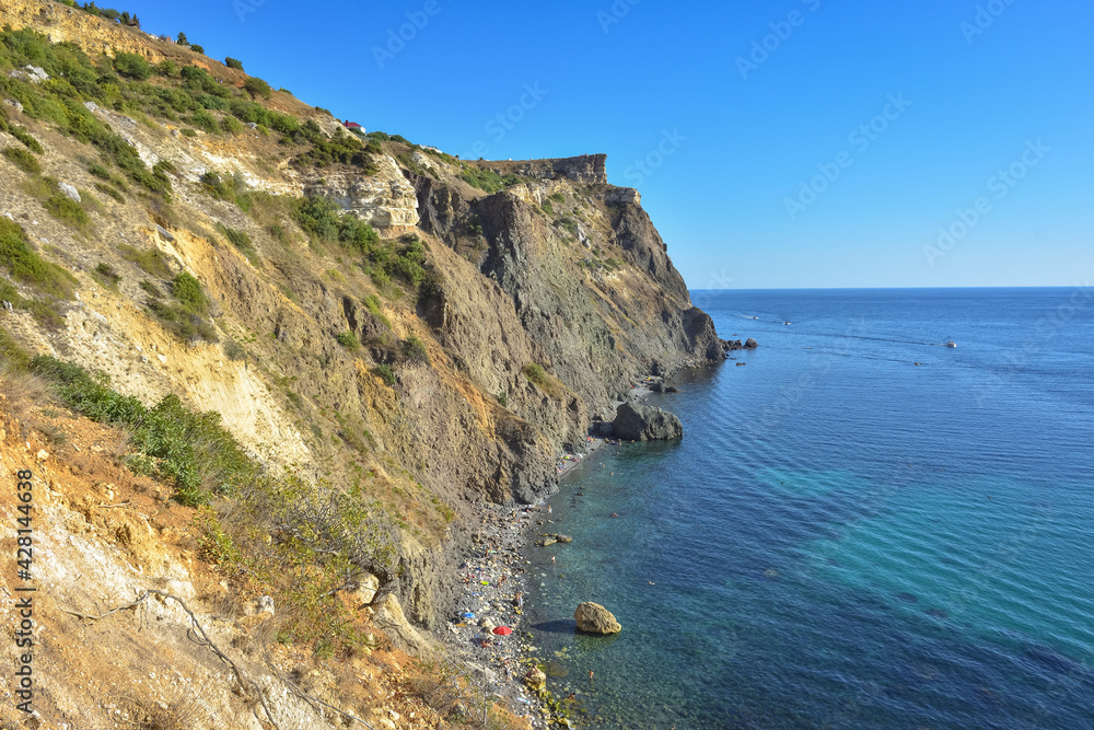 Cape Fiolent. Beautiful views of the Black Sea coast at Cape Fiolent in summer in clear weather. Aerial view to beautiful sea coast with turquoise water and rocks