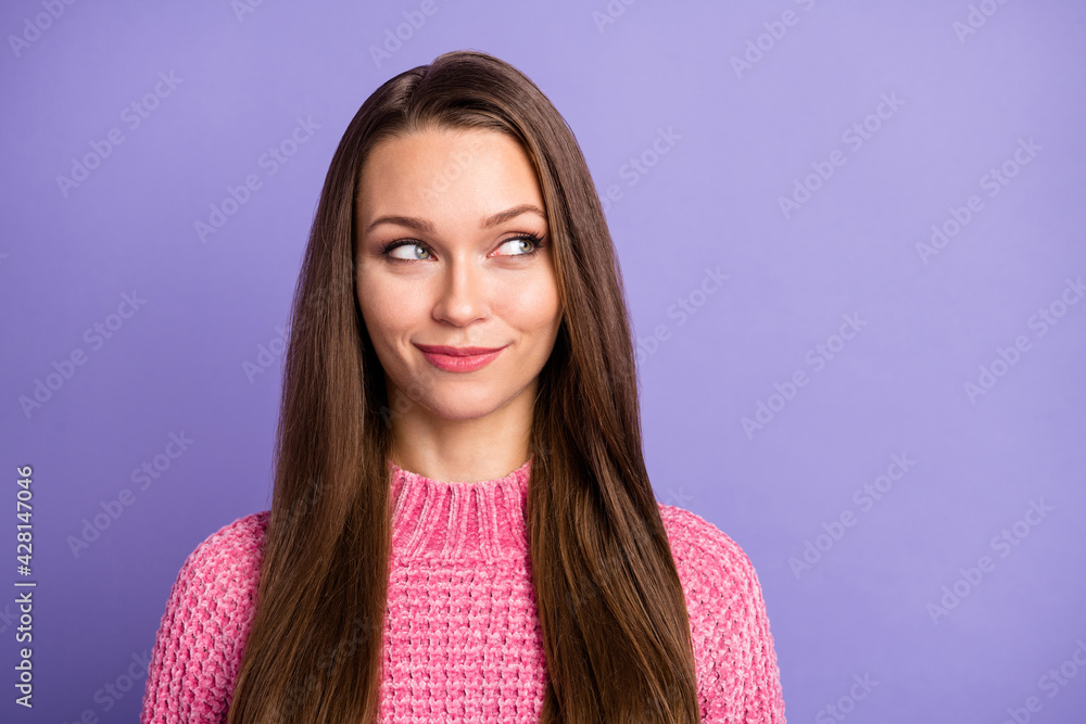 Photo of funny cunning lady look silly eyes side empty space wear pink knitted pullover isolated purple color background Photo of funny cunning lady look silly eyes side empty space wear pink knitted pullover isolated purple color background
