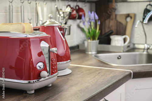 Red toaster and electric kettle in retro slile
