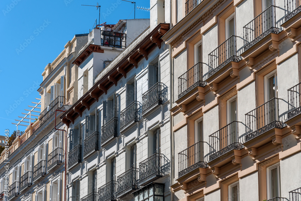 Old luxury residential buildings with balconies in historic centre of Madrid. Concept rent regulation and real estate