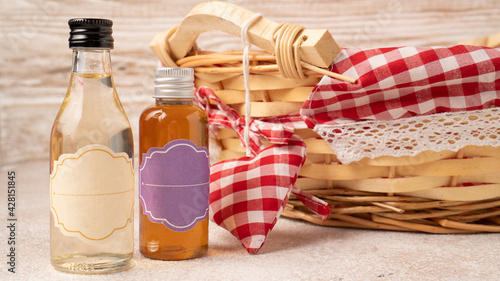 Homemade vanilla syrup and hazelnut syrup in glass bottle containers. Caramel coffee syrups for flavoring a drink