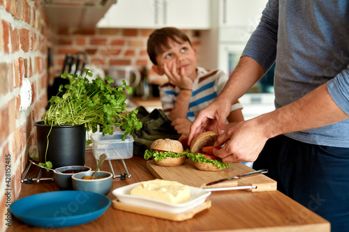Fotografie Close up of father making lunch for son in kitchen