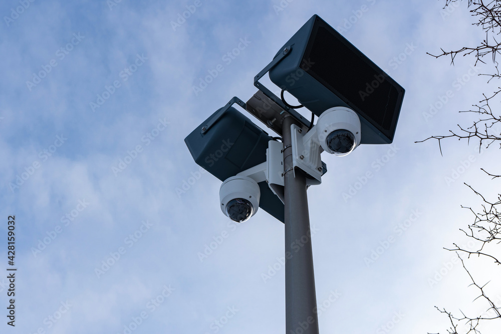 CCTV cameras and loudspeakers against the sky CCTV cameras and loudspeakers against the sky