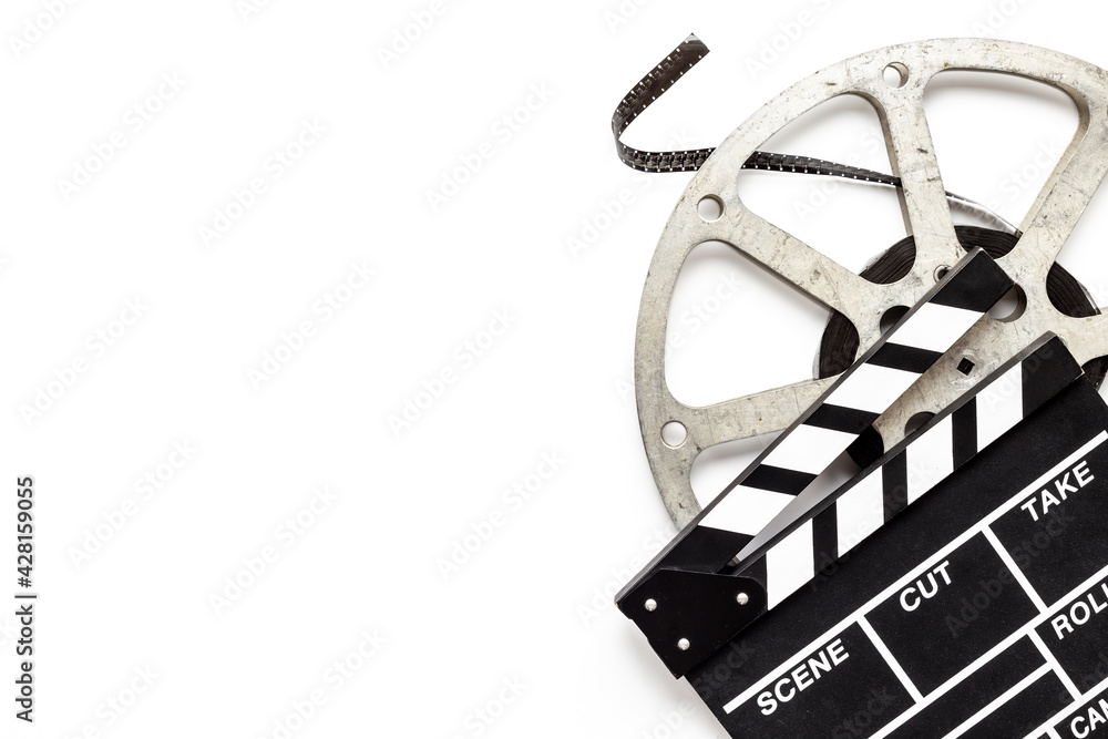 Cinema background with movie clapperboard and film reel