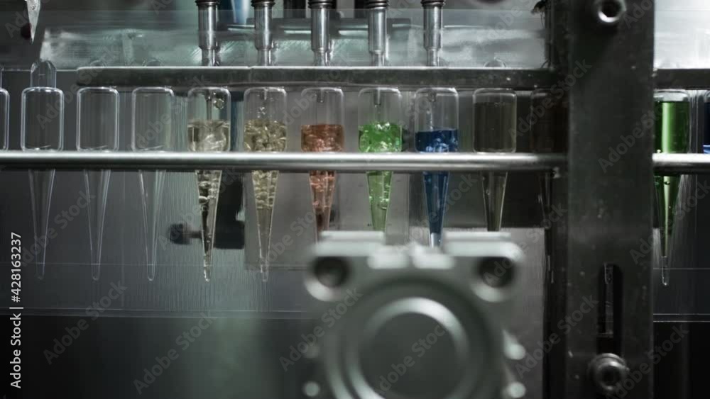 Automatic machine for pouring medicine into ampoules or test tubes. Automatic machine for pouring medicine into ampoules or test tubes.
