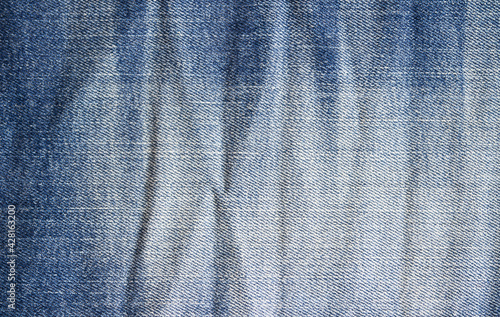High detailed photo of classic blue jeans fabric, denim...