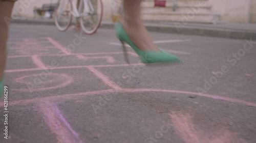 Woman Jumping Hopscotch in High Heels 2