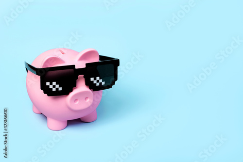 Pink piggy money bank with black sunglasses Fototapeta