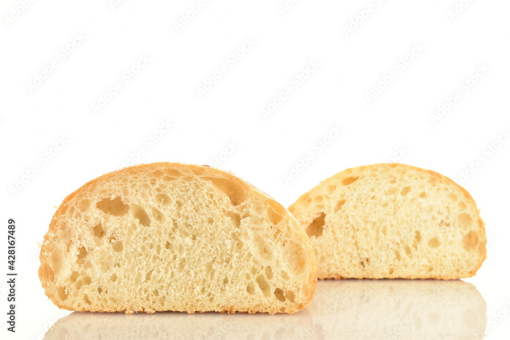 Two halves of fresh aromatic ciabatta, close-up, isolated on white.