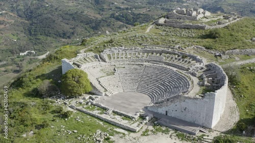 Ancient theater of Segesta partly excavated in the rock of the hill. Segesta Archaeological Park in the province of Trapani. Ancient Sicily.