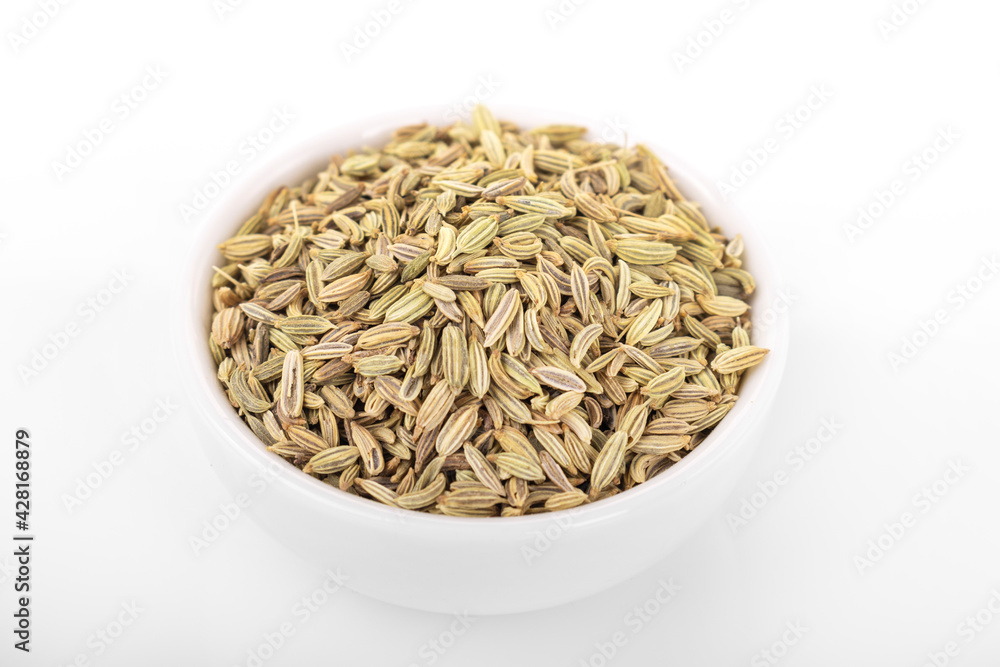 fennel seed. dry fennel seed in white bowl on white background. fennel fennel seed. dry fennel seed in white bowl on white background. fennel