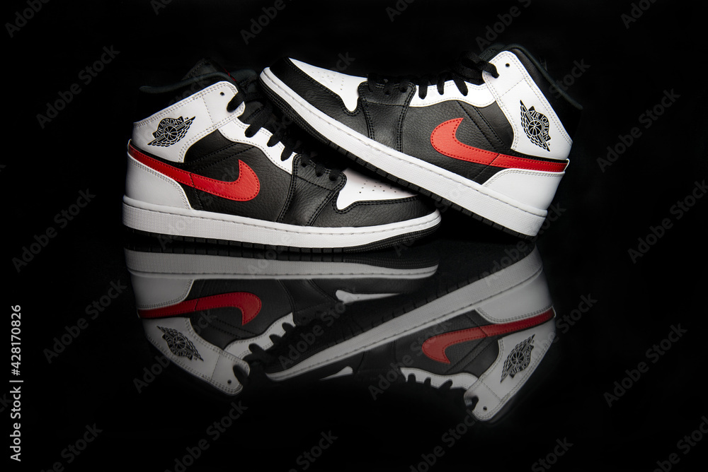 Nike Jordan 1 Mid Black Chile Red White shoes Stock Photo | Adobe Stock