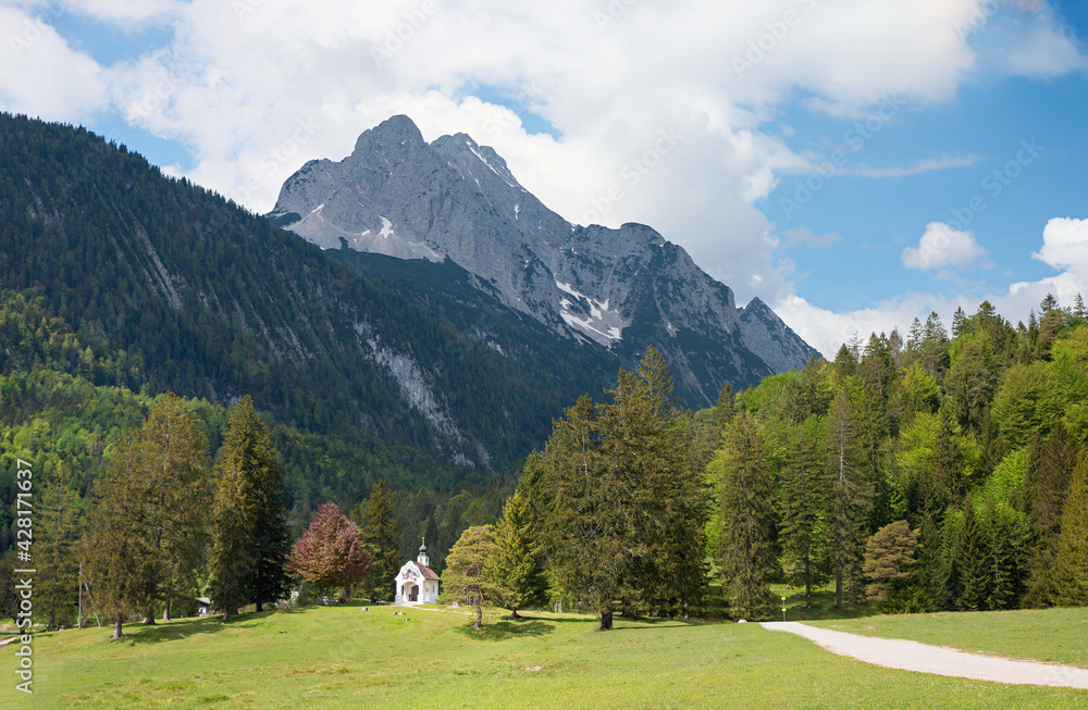 idyllic alpine landscape with chapel, bavarian alps near lake Lautersee