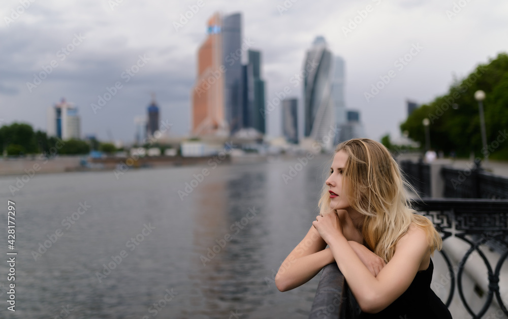 Outdoors portrait of beautiful young woman. Outdoors portrait of beautiful young woman.