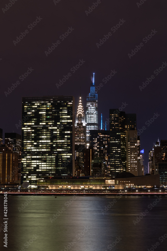 Nighttime Midtown Manhattan Skyline along the East River in New York City