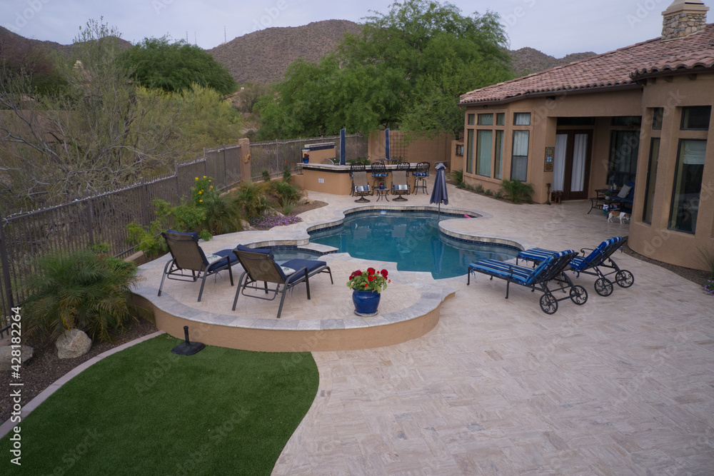 A high definition aerial view of a desert landscaped yard in the southwestern United States. A high definition aerial view of a desert landscaped yard in the southwestern United States.