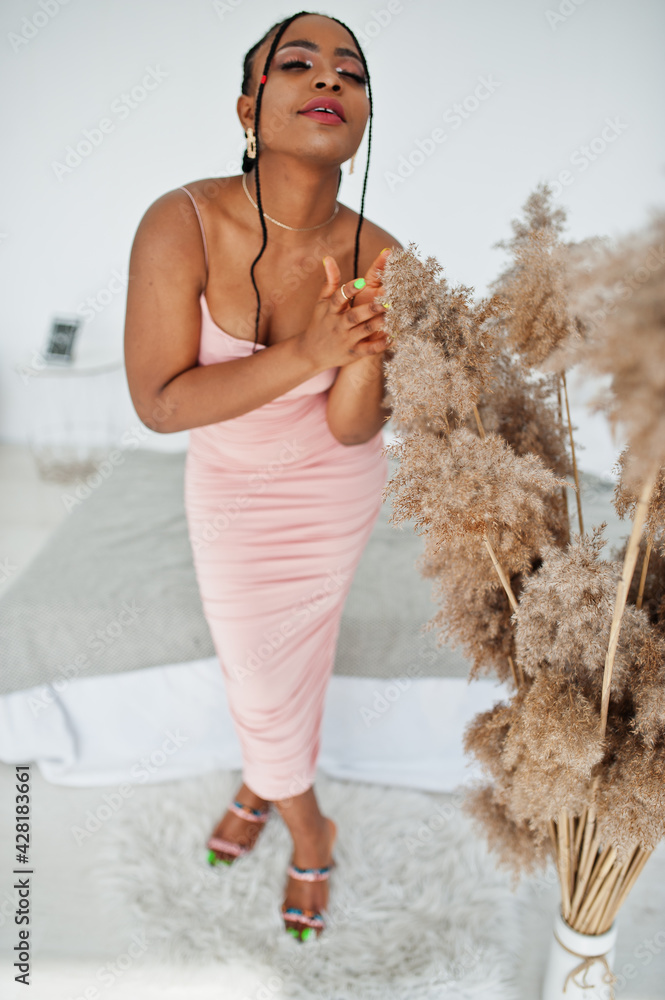 Fashionable photo of young beautiful romantic african american woman with perfect makeup, wearing pink dress. Summer, spring style. Fashionable photo of young beautiful romantic african american woman with perfect makeup, wearing pink dress. Summer, spring style.