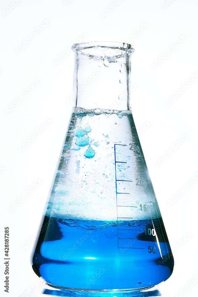 Glass flask with a chemical reagent. Glass flask with a chemical reagent.
