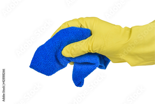 A hand in a yellow glove holds a blue cleaning cloth.