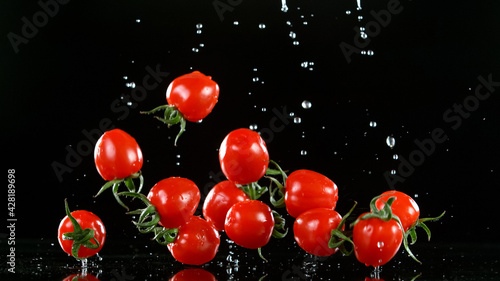 Cherry tomatoes falling on ...