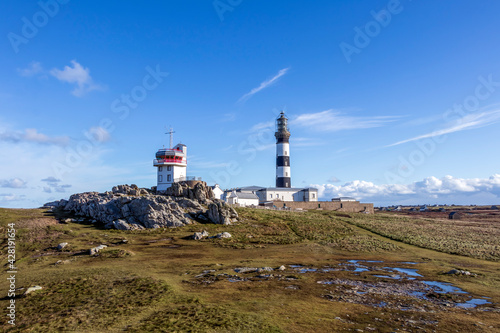 Lighthouse and Beacon of Ouessant, the island of Ushant, in Brittany, french rocky beach in northern France, Finistere