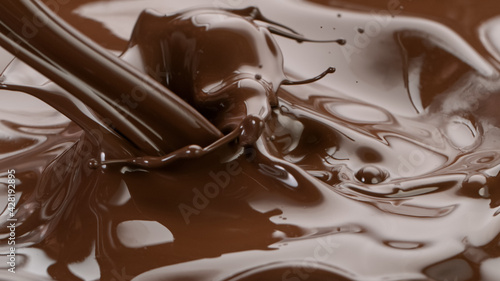 Splashing hot chocolate texture, close-up.
